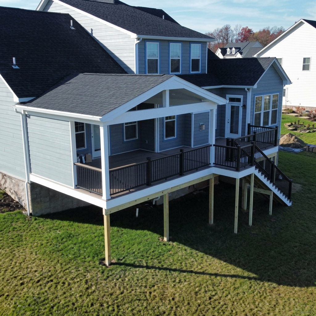 Two-story home with elevated white deck and stairs